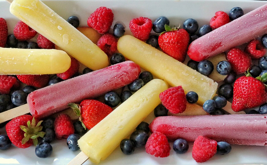 Fresh fruit popsicles and berries